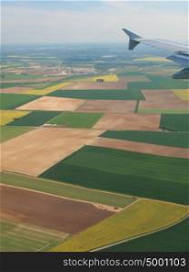 Spainish meadows as seen through window of an airplane