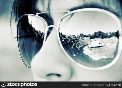 Spanish archaeological site reflected in woman&acute;s sunglasses