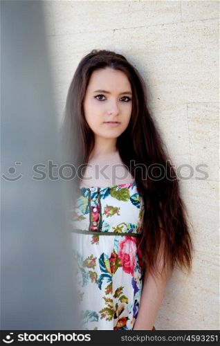 Spanish brunette girl with long hair on the street