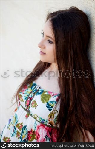 Spanish brunette girl with long hair on the street