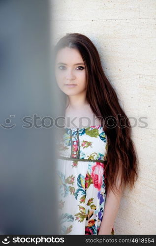 Spanish brunette girl with long hair on the street