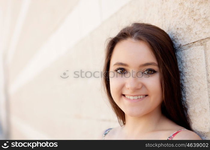 Spanish brunette girl with long hair on the street