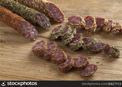 Spanish fuet sausages in three different flavors with slices