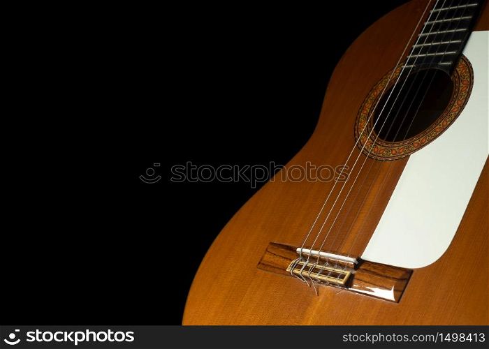 Spanish guitar on a black background