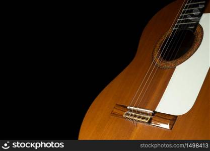 Spanish guitar on a black background