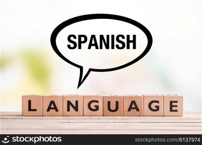 Spanish language lesson sign made of cubes on a table