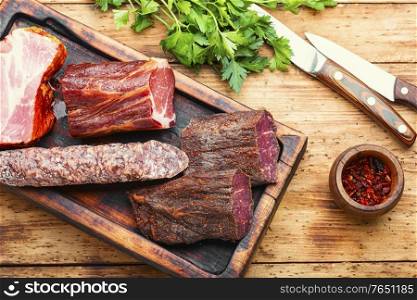 Spanish meat platter.Cured meat and sausages on cutting board. Spanish cured meat