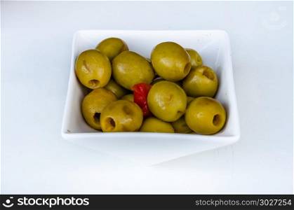 Spanish olives background. Background of green Spanish olives on white background