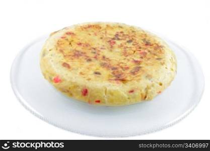 Spanish omelette made a??a??with potatoes, eggs, onion, green and red peppers, salt and olive oil, horizontal format with a white background isolated