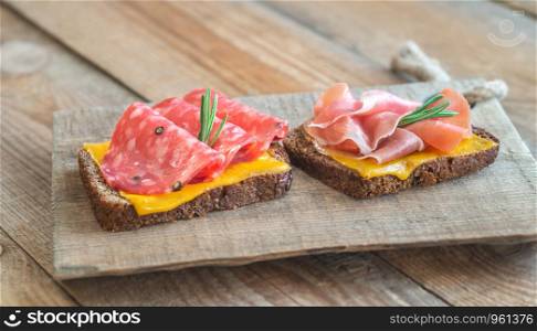 Spanish sandwiches with salchichon anb jamon close-up
