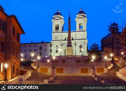 Spanish Steps at night, Rome, Italy.. Monumental stairway Spanish Steps, seen from Piazza di Spagna, and Trinita dei Monti church during morning blue hour, Rome, Italy.