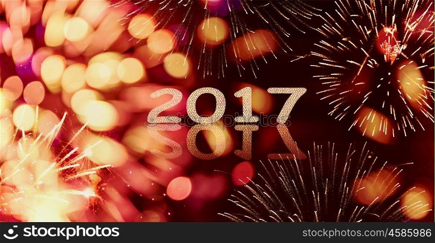 Sparkle and bokeh New year firework background with written 2017, banner