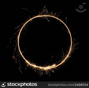 Sparkler circle. Burning bengal fire round letter o number zero. Isolated on black.