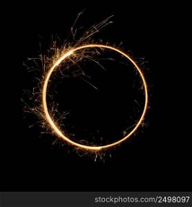 Sparkler circle shape. Burning bengal fire round letter o number zero, long exposure.
