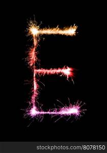 Sparkler firework light alphabet E (Capital Letters) at night background