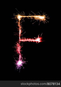 Sparkler firework light alphabet F (Capital Letters) at night background