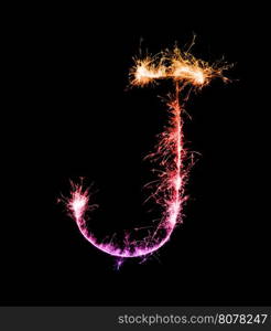 Sparkler firework light alphabet J (Capital Letters) at night background