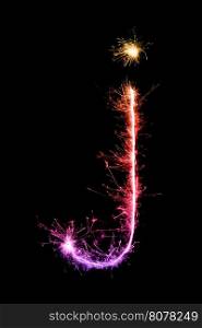 Sparkler firework light alphabet j (Small Letters) at night background
