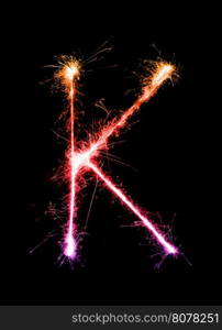 Sparkler firework light alphabet K (Capital Letters) at night background