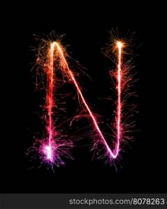 Sparkler firework light alphabet N (Capital Letters) at night background