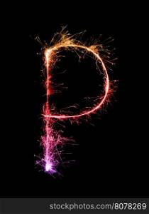 Sparkler firework light alphabet P at night background
