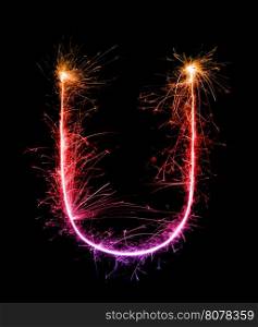 Sparkler firework light alphabet U (Capital Letters) at night background