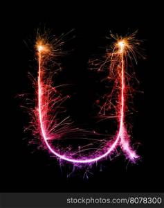 Sparkler firework light alphabet u (Small Letters) at night background