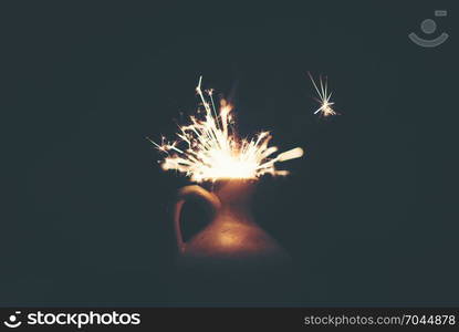 Sparkler with background Christmas light bokeh