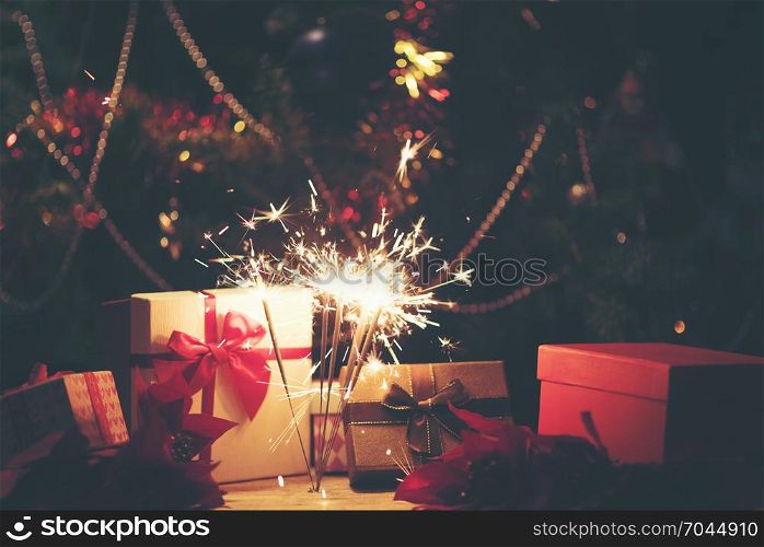 Sparkler with background Christmas light bokeh