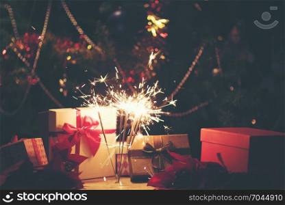 Sparkler with background Christmas light bokeh