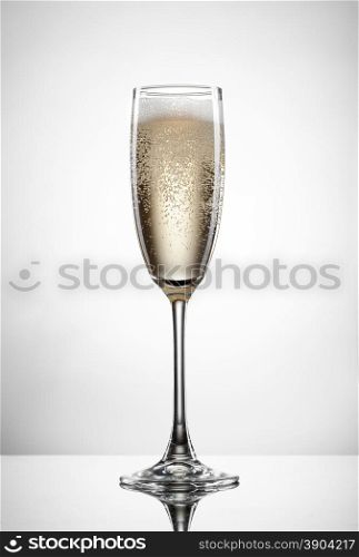 Sparkling champagne in glass isolated on white background
