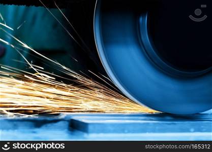 Sparks from grinding machine in workshop. Industrial background, industry.. Sparks from grinding machine. Industrial, industry