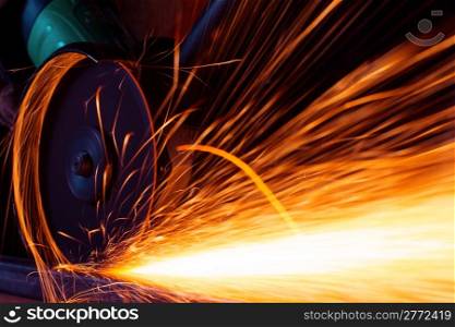Sparks while grinding iron