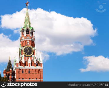 Spasskaya clock Tower of Moscow Kremlin and white cloud in blue sky in sunny day