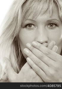 Speak no evil concept. Surprised woman face, covering her mouth with hands isolated