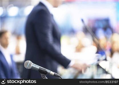 Speaker giving a speech at business conference, presentation or media event