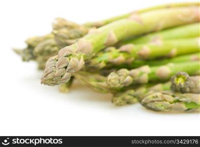 Spears of Fresh Uncooked Asparagus on White Background - Shallow Depth of Field