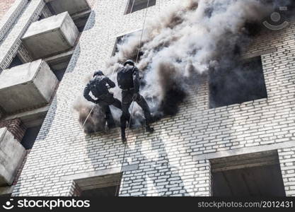 Spec ops police officer SWAT during assault operation. SWAT assault operation