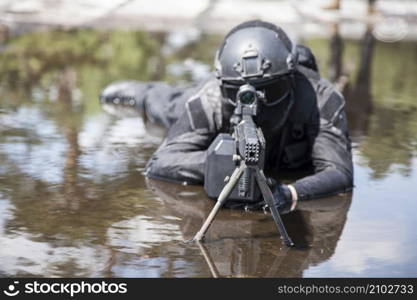 Spec ops police officer SWAT in action in the water. Spec ops police officer SWAT