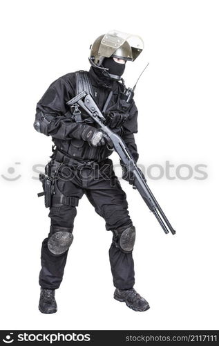 Spec ops soldier in black uniform and face mask with shotgun