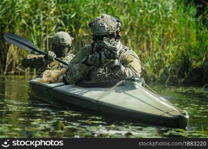 Special forces operators in the military kayak. Spec ops in the military kayak