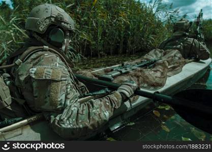 Special forces operators in the military kayak. Spec ops in the military kayak
