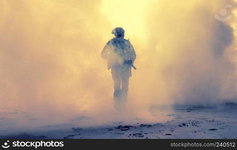 Special operations forces soldier, army ranger or commando in camo uniform, helmet and ballistic glasses walking at battlefield covered with smoke. Airsoft war game player coming through smoke screen. Armed infantry in smoke during military operation