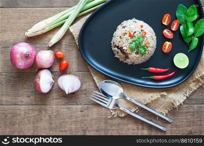 Special Thai Food. Fried rice with mackerel, chilli, lime leaves, onion and Thai herbs. Creative flat lay with food ingredients