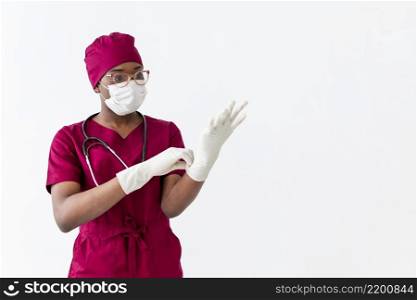 specialist female doctor putting gloves