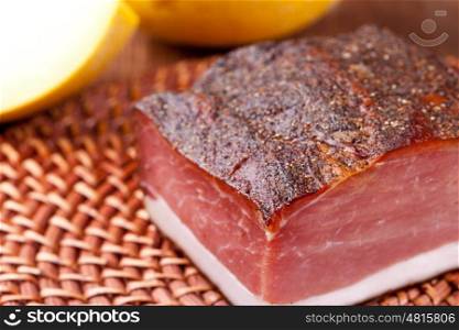 speck. Italian speck on a wooden table