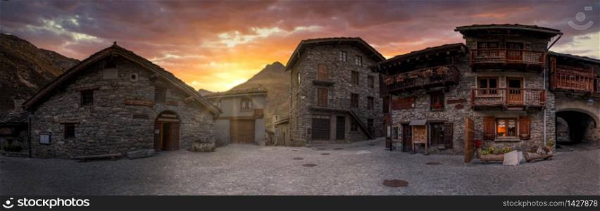 Spectacular sunset at small village with stone houses in the French Alps.