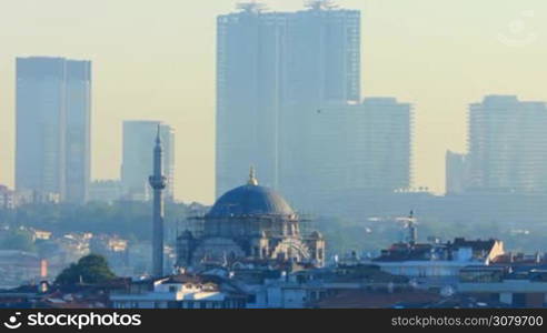 Spectacular view of a Mosque in Istanbul with skyscrapers in the background