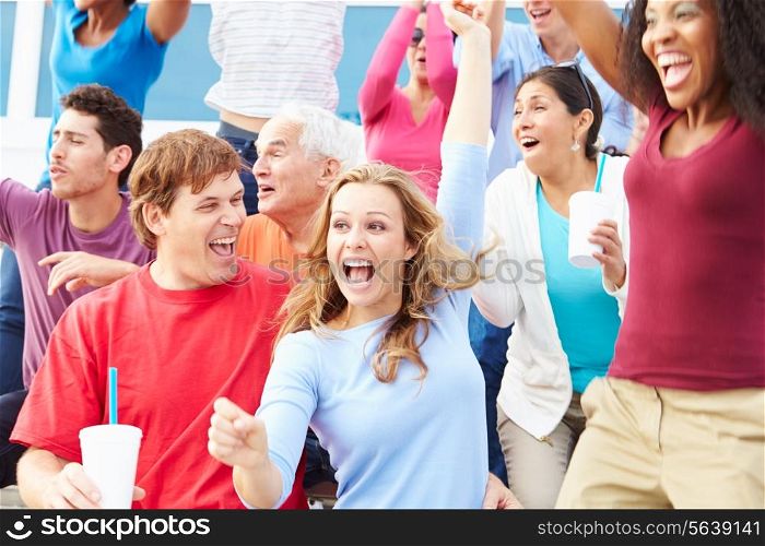 Spectators Celebrating At Outdoor Sports Event