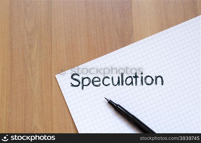 Speculation text concept write on notebook with pen